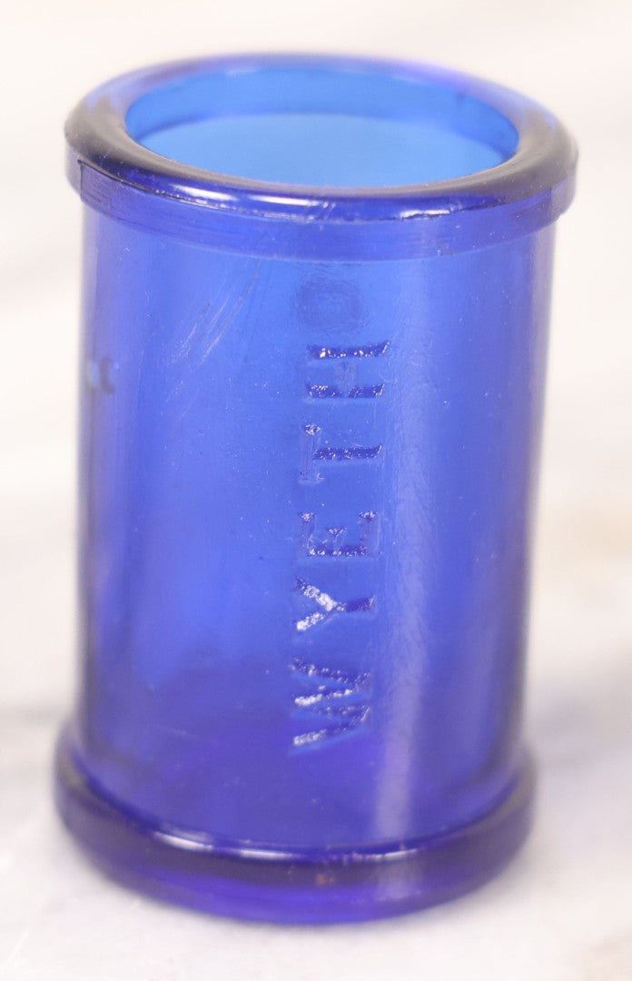 Lot 066 - Grouping Of Three Antique Cobalt Blue Glass Poison Bottles, Including Embossed “Poison” With Horizontal Ribs, Embossed “Wyeth Poison” Without Ribs, And Whitall Tatum Co. Bottle With Partial Paper Label