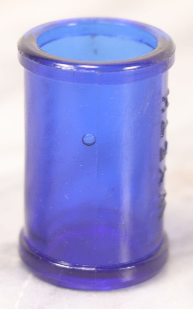 Lot 066 - Grouping Of Three Antique Cobalt Blue Glass Poison Bottles, Including Embossed “Poison” With Horizontal Ribs, Embossed “Wyeth Poison” Without Ribs, And Whitall Tatum Co. Bottle With Partial Paper Label