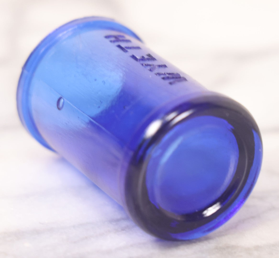 Lot 066 - Grouping Of Three Antique Cobalt Blue Glass Poison Bottles, Including Embossed “Poison” With Horizontal Ribs, Embossed “Wyeth Poison” Without Ribs, And Whitall Tatum Co. Bottle With Partial Paper Label