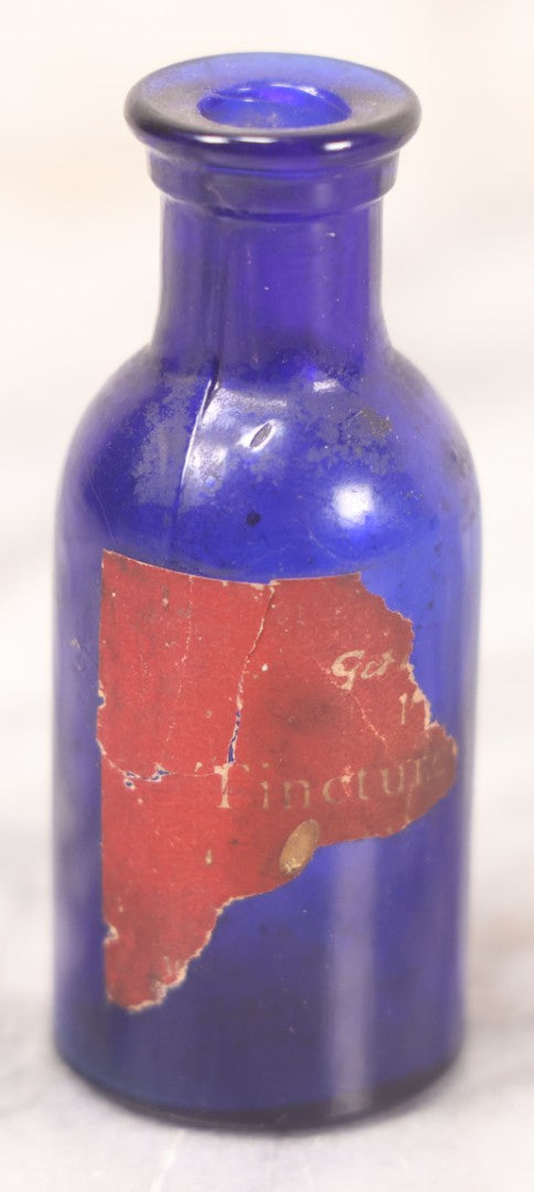 Lot 066 - Grouping Of Three Antique Cobalt Blue Glass Poison Bottles, Including Embossed “Poison” With Horizontal Ribs, Embossed “Wyeth Poison” Without Ribs, And Whitall Tatum Co. Bottle With Partial Paper Label
