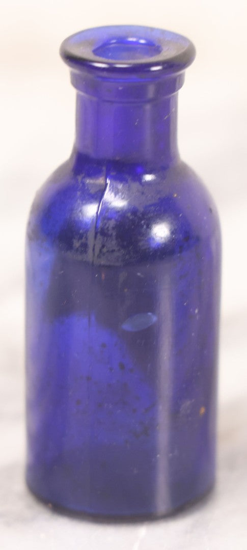 Lot 066 - Grouping Of Three Antique Cobalt Blue Glass Poison Bottles, Including Embossed “Poison” With Horizontal Ribs, Embossed “Wyeth Poison” Without Ribs, And Whitall Tatum Co. Bottle With Partial Paper Label