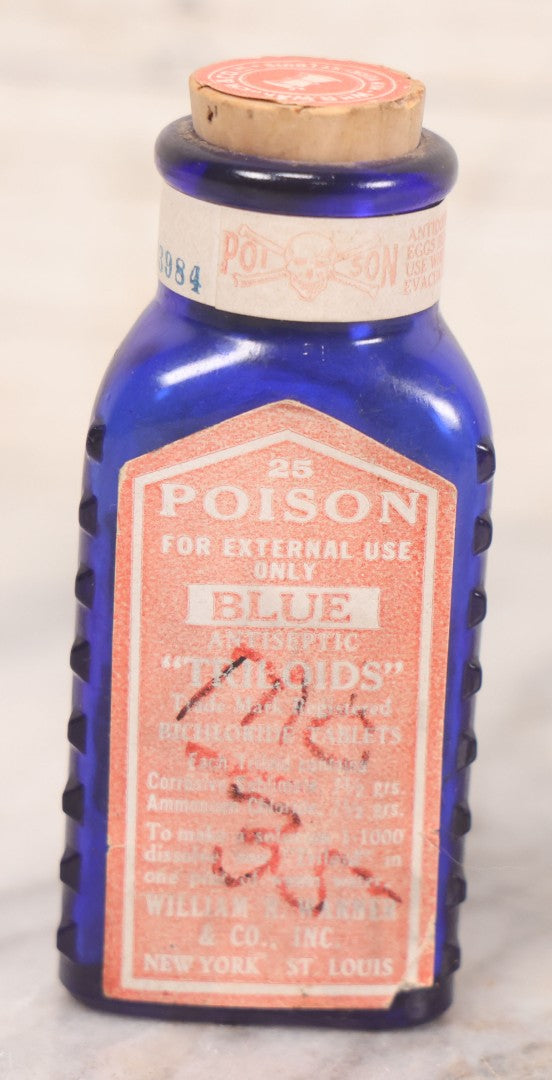 Lot 067 - Grouping Of Three Antique Small Cobalt Blue Glass Poison Bottles, Including Crosshatch Poison Ribbed And Two Triangular “Antiseptic Triloids” Bottles By William R. Warner & Co. Inc., New York & St. Louis, With Paper Labels