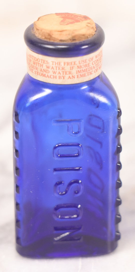 Lot 067 - Grouping Of Three Antique Small Cobalt Blue Glass Poison Bottles, Including Crosshatch Poison Ribbed And Two Triangular “Antiseptic Triloids” Bottles By William R. Warner & Co. Inc., New York & St. Louis, With Paper Labels