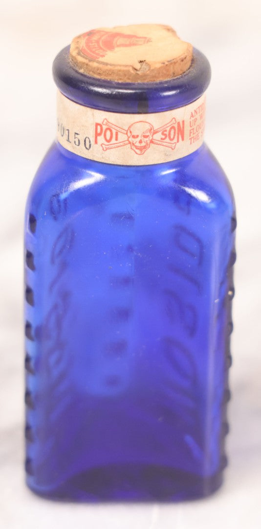 Lot 067 - Grouping Of Three Antique Small Cobalt Blue Glass Poison Bottles, Including Crosshatch Poison Ribbed And Two Triangular “Antiseptic Triloids” Bottles By William R. Warner & Co. Inc., New York & St. Louis, With Paper Labels