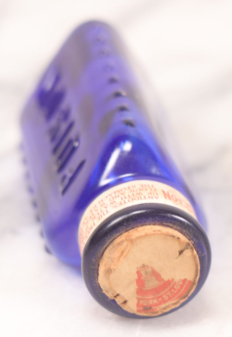 Lot 067 - Grouping Of Three Antique Small Cobalt Blue Glass Poison Bottles, Including Crosshatch Poison Ribbed And Two Triangular “Antiseptic Triloids” Bottles By William R. Warner & Co. Inc., New York & St. Louis, With Paper Labels