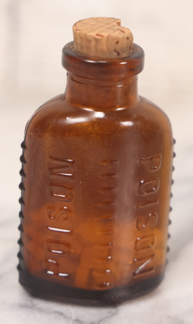 Lot 068 - Grouping Of Five Antique Amber Glass Poison Bottles With Horizontal Poison Ribs, Including Faded Eli Lilly & Co. Label And Kern Pharmacy Label, Flushing, New York, One With Eli Lilly & Co. Atropine Sulphate Label, And Three Without Labels