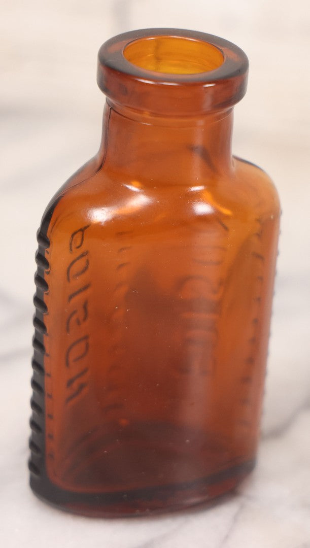 Lot 068 - Grouping Of Five Antique Amber Glass Poison Bottles With Horizontal Poison Ribs, Including Faded Eli Lilly & Co. Label And Kern Pharmacy Label, Flushing, New York, One With Eli Lilly & Co. Atropine Sulphate Label, And Three Without Labels