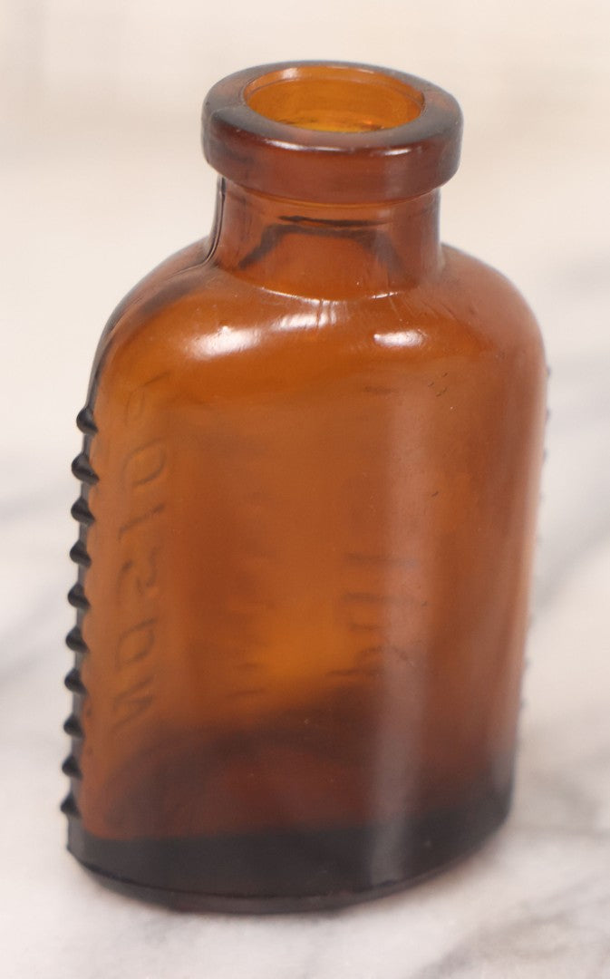 Lot 068 - Grouping Of Five Antique Amber Glass Poison Bottles With Horizontal Poison Ribs, Including Faded Eli Lilly & Co. Label And Kern Pharmacy Label, Flushing, New York, One With Eli Lilly & Co. Atropine Sulphate Label, And Three Without Labels