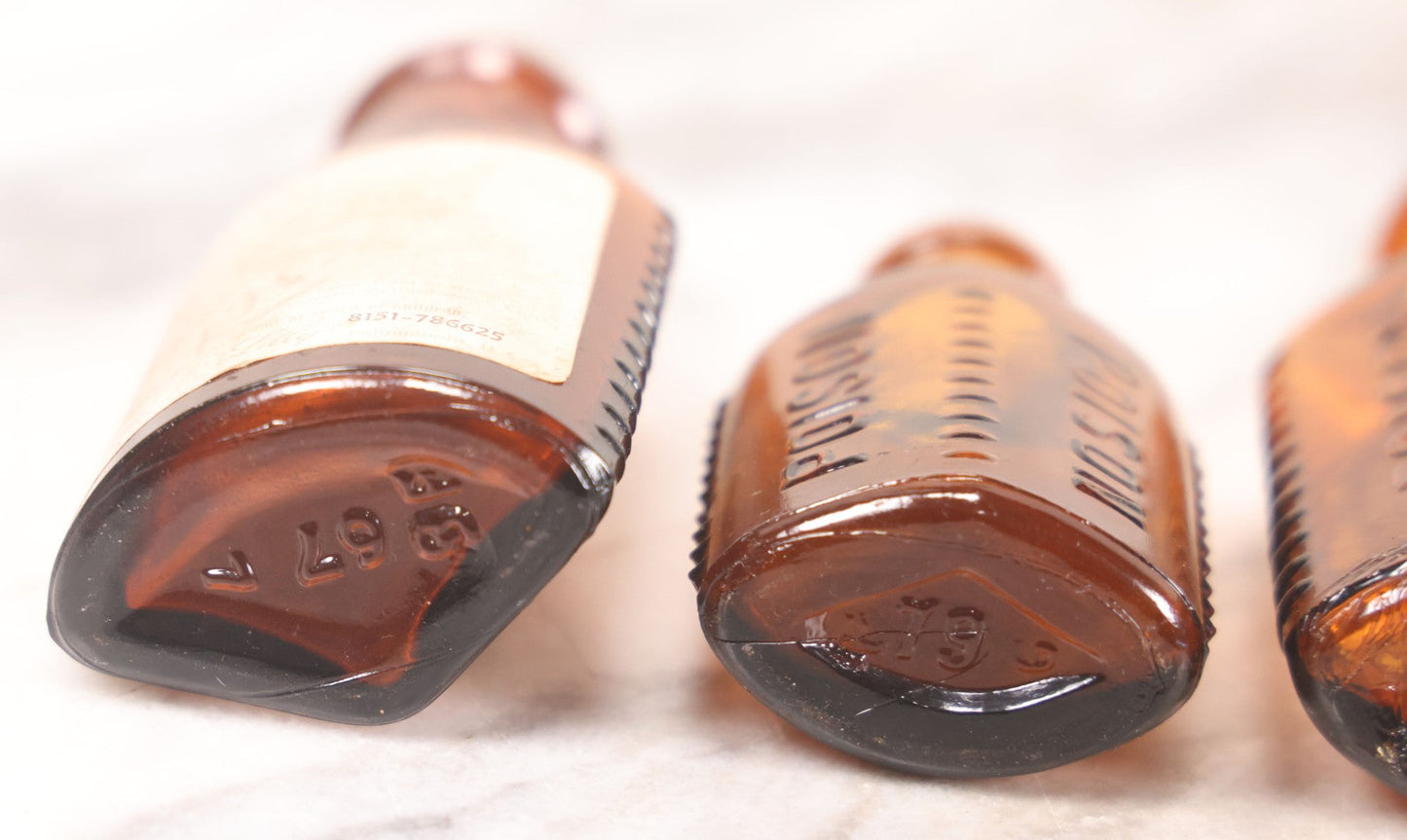 Lot 068 - Grouping Of Five Antique Amber Glass Poison Bottles With Horizontal Poison Ribs, Including Faded Eli Lilly & Co. Label And Kern Pharmacy Label, Flushing, New York, One With Eli Lilly & Co. Atropine Sulphate Label, And Three Without Labels