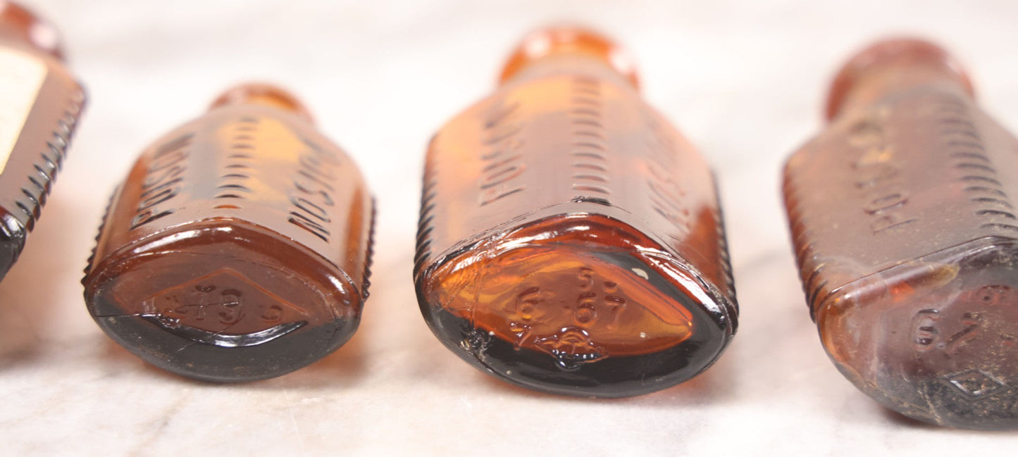 Lot 068 - Grouping Of Five Antique Amber Glass Poison Bottles With Horizontal Poison Ribs, Including Faded Eli Lilly & Co. Label And Kern Pharmacy Label, Flushing, New York, One With Eli Lilly & Co. Atropine Sulphate Label, And Three Without Labels