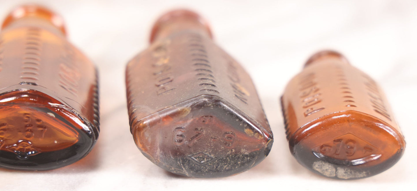 Lot 068 - Grouping Of Five Antique Amber Glass Poison Bottles With Horizontal Poison Ribs, Including Faded Eli Lilly & Co. Label And Kern Pharmacy Label, Flushing, New York, One With Eli Lilly & Co. Atropine Sulphate Label, And Three Without Labels