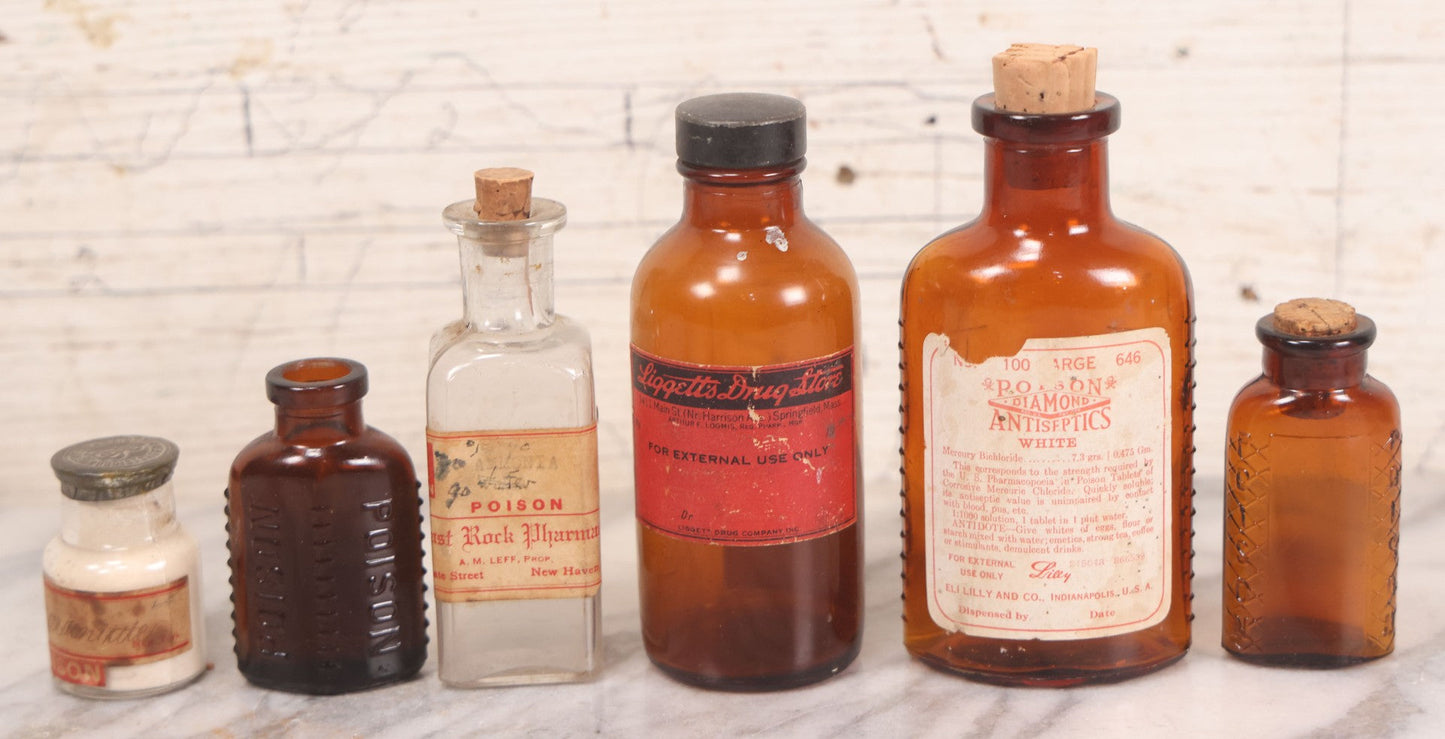 Lot 069 - Grouping Of Six Antique Poison Bottles Including Amber With Crosshatch Poison Ribs, Eli Lilly & Co. Diamond Antiseptics, Clear Chinum Arsenate With Eimer & Amend Lid, East Rock Pharmacy New Haven, And Liggett's Springfield, Ma