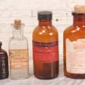 Lot 069 - Grouping Of Six Antique Poison Bottles Including Amber With Crosshatch Poison Ribs, Eli Lilly & Co. Diamond Antiseptics, Clear Chinum Arsenate With Eimer & Amend Lid, East Rock Pharmacy New Haven, And Liggett's Springfield, Ma