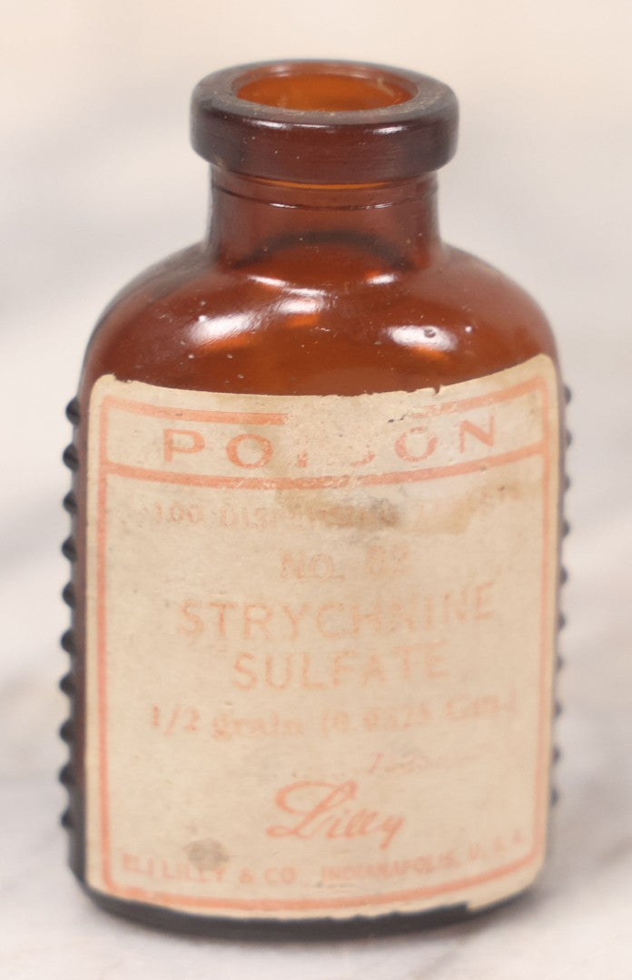 Lot 069 - Grouping Of Six Antique Poison Bottles Including Amber With Crosshatch Poison Ribs, Eli Lilly & Co. Diamond Antiseptics, Clear Chinum Arsenate With Eimer & Amend Lid, East Rock Pharmacy New Haven, And Liggett's Springfield, Ma