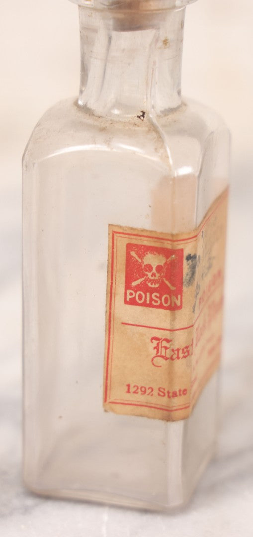 Lot 069 - Grouping Of Six Antique Poison Bottles Including Amber With Crosshatch Poison Ribs, Eli Lilly & Co. Diamond Antiseptics, Clear Chinum Arsenate With Eimer & Amend Lid, East Rock Pharmacy New Haven, And Liggett's Springfield, Ma