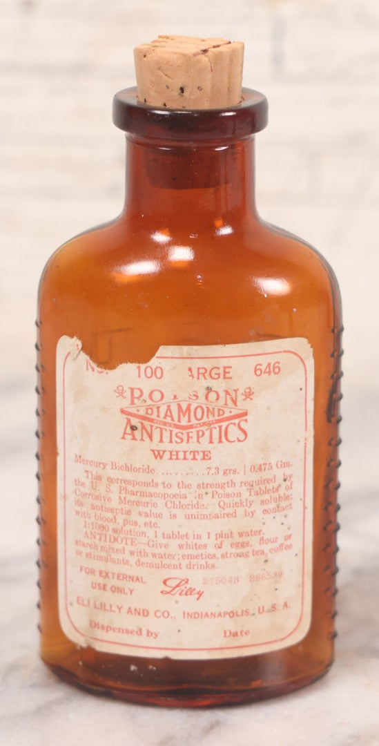 Lot 069 - Grouping Of Six Antique Poison Bottles Including Amber With Crosshatch Poison Ribs, Eli Lilly & Co. Diamond Antiseptics, Clear Chinum Arsenate With Eimer & Amend Lid, East Rock Pharmacy New Haven, And Liggett's Springfield, Ma