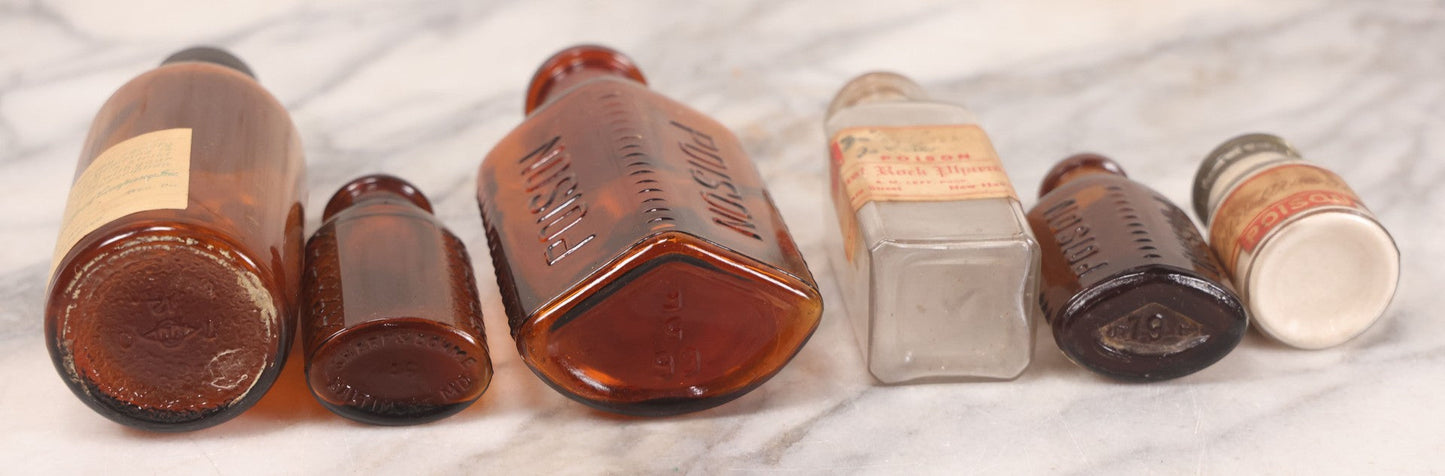 Lot 069 - Grouping Of Six Antique Poison Bottles Including Amber With Crosshatch Poison Ribs, Eli Lilly & Co. Diamond Antiseptics, Clear Chinum Arsenate With Eimer & Amend Lid, East Rock Pharmacy New Haven, And Liggett's Springfield, Ma