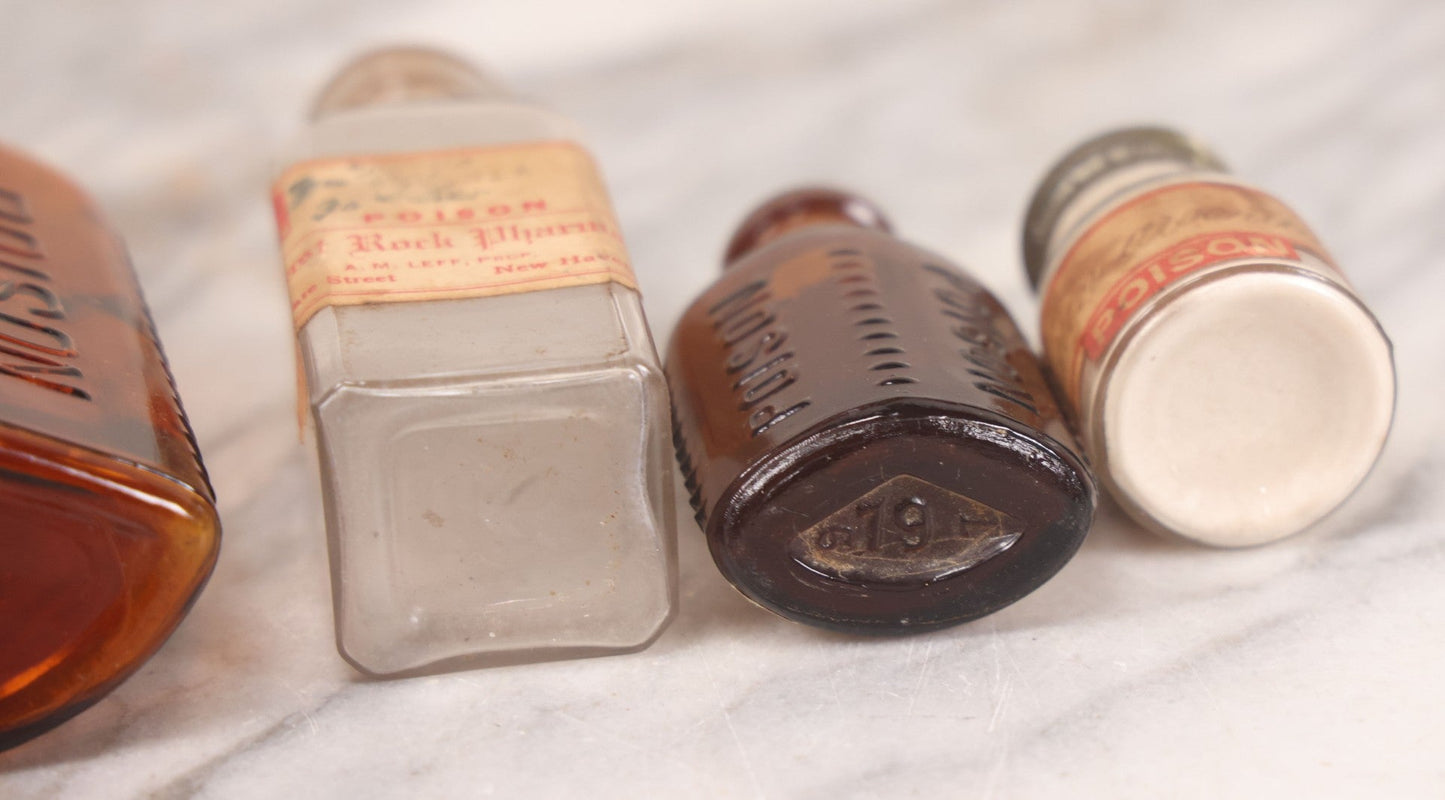 Lot 069 - Grouping Of Six Antique Poison Bottles Including Amber With Crosshatch Poison Ribs, Eli Lilly & Co. Diamond Antiseptics, Clear Chinum Arsenate With Eimer & Amend Lid, East Rock Pharmacy New Haven, And Liggett's Springfield, Ma