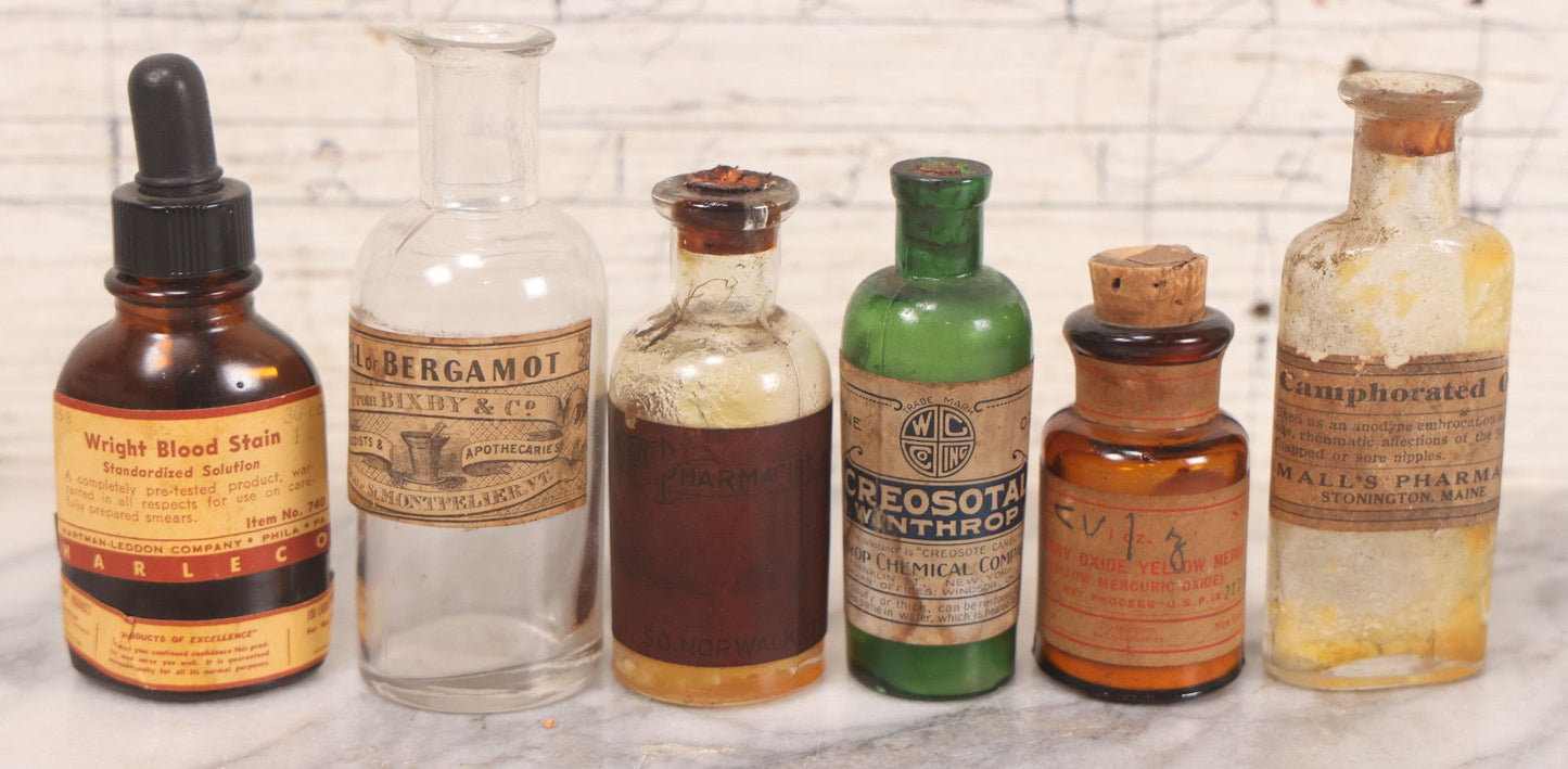 Lot 071 - Grouping Of Six Antique And Vintage Bottles Including Camphorated Oil From Small's Pharmacy, Stonington, Maine, Oil Of Bergamot From Bixby & Co., Montpelier, Vermont, Wright Blood Stain From Hartman Leddon Co., Philadelphia, And Others