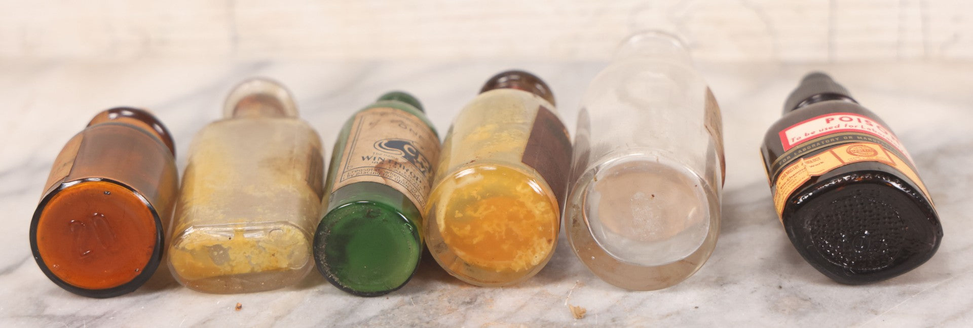 Lot 071 - Grouping Of Six Antique And Vintage Bottles Including Camphorated Oil From Small's Pharmacy, Stonington, Maine, Oil Of Bergamot From Bixby & Co., Montpelier, Vermont, Wright Blood Stain From Hartman Leddon Co., Philadelphia, And Others