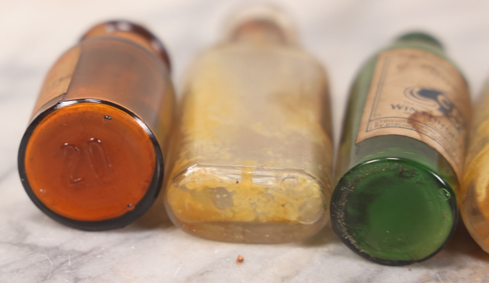 Lot 071 - Grouping Of Six Antique And Vintage Bottles Including Camphorated Oil From Small's Pharmacy, Stonington, Maine, Oil Of Bergamot From Bixby & Co., Montpelier, Vermont, Wright Blood Stain From Hartman Leddon Co., Philadelphia, And Others