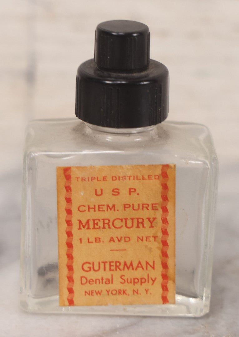 Lot 073 - Grouping Of Five Antique Bottles With Paper Labels Including Witch Hazel, John Laws, Columbus M.S., Spirit Of Peppermint, Koch's Pharm., Greenwich, R.I., Potassium Metabisulphate, Kodak, Mercury, Guterman Dental, N.Y., & Nux Vomica