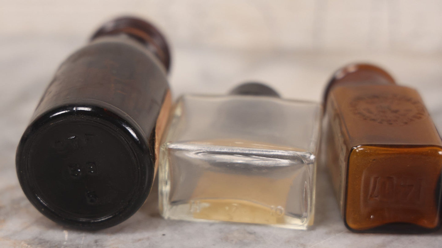 Lot 073 - Grouping Of Five Antique Bottles With Paper Labels Including Witch Hazel, John Laws, Columbus M.S., Spirit Of Peppermint, Koch's Pharm., Greenwich, R.I., Potassium Metabisulphate, Kodak, Mercury, Guterman Dental, N.Y., & Nux Vomica