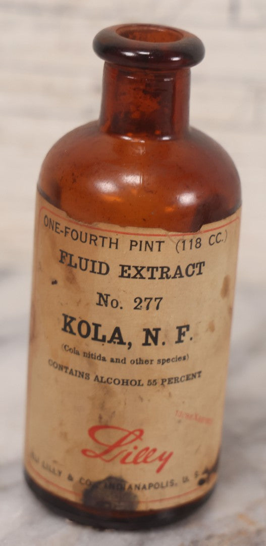 Lot 074 - Grouping Of Five Antique Amber Glass Bottles Including Digitalis From Eli Lilly & Co., Indianapolis, Phytolacca From Parke, Davis & Co., Detroit, De Mercure Codex 1908, And Kola From Eli Lilly & Co., And Others