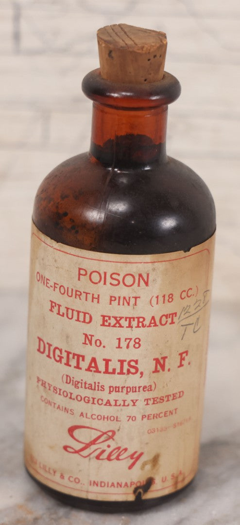 Lot 074 - Grouping Of Five Antique Amber Glass Bottles Including Digitalis From Eli Lilly & Co., Indianapolis, Phytolacca From Parke, Davis & Co., Detroit, De Mercure Codex 1908, And Kola From Eli Lilly & Co., And Others
