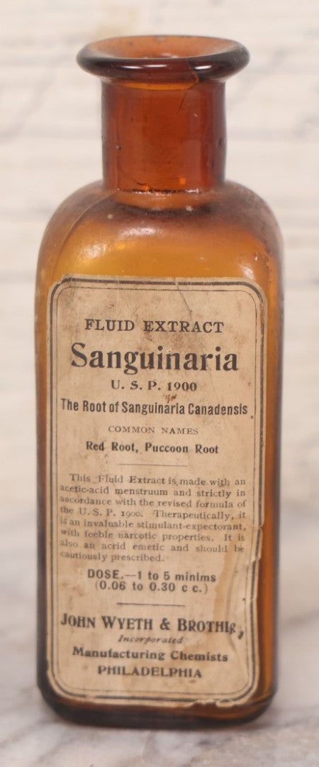 Lot 075 - Grouping Of Four Antique Amber Glass Bottles Including Cramp Bark From Sharp & Dohme, Baltimore, Sanguinaria From John Wyeth & Brother, Philadelphia, H.K. Mulford Co., Philadelphia, And One Unmarked With Stopper