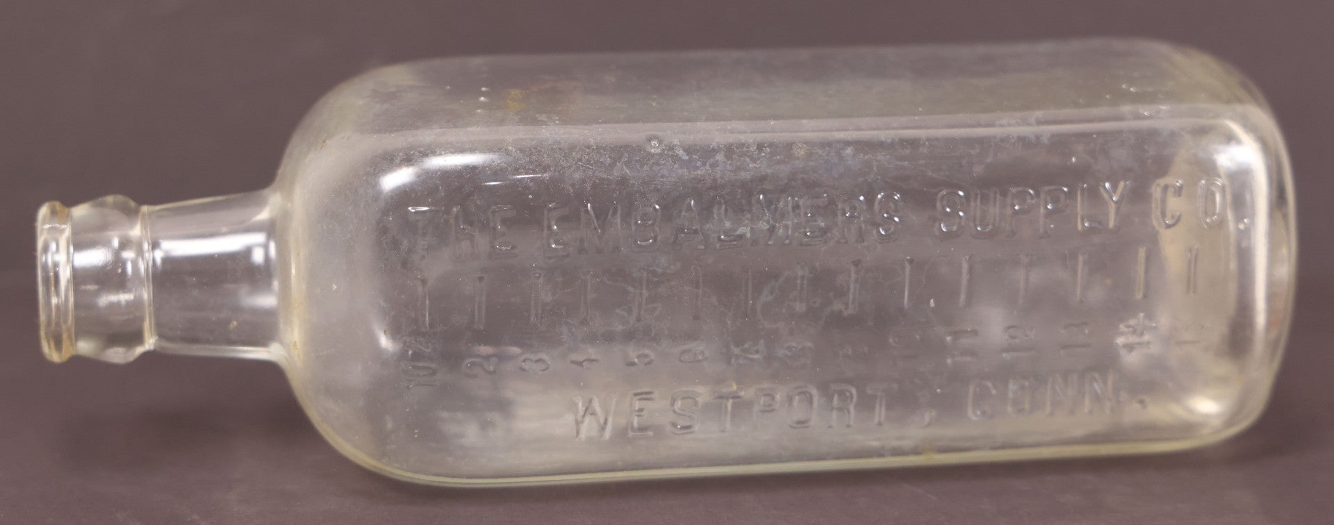 Lot 076 - Grouping Of Three Antique Clear Glass Bottles Including Embalming Supply Co., Westport, Connecticut, Rochester Germicide Co., Rochester, New York, And G.S. Stoddard & Co., New York