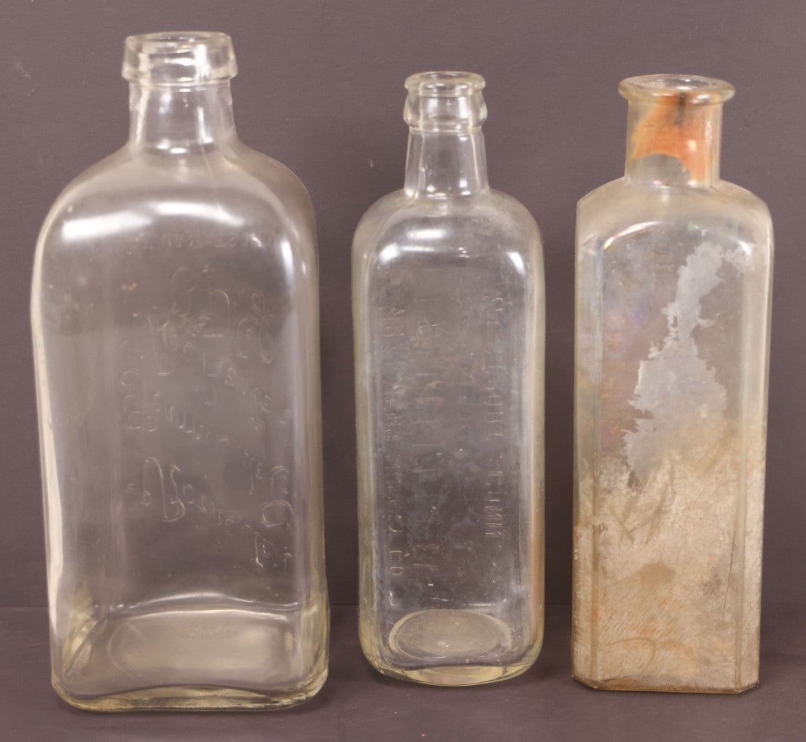 Lot 076 - Grouping Of Three Antique Clear Glass Bottles Including Embalming Supply Co., Westport, Connecticut, Rochester Germicide Co., Rochester, New York, And G.S. Stoddard & Co., New York