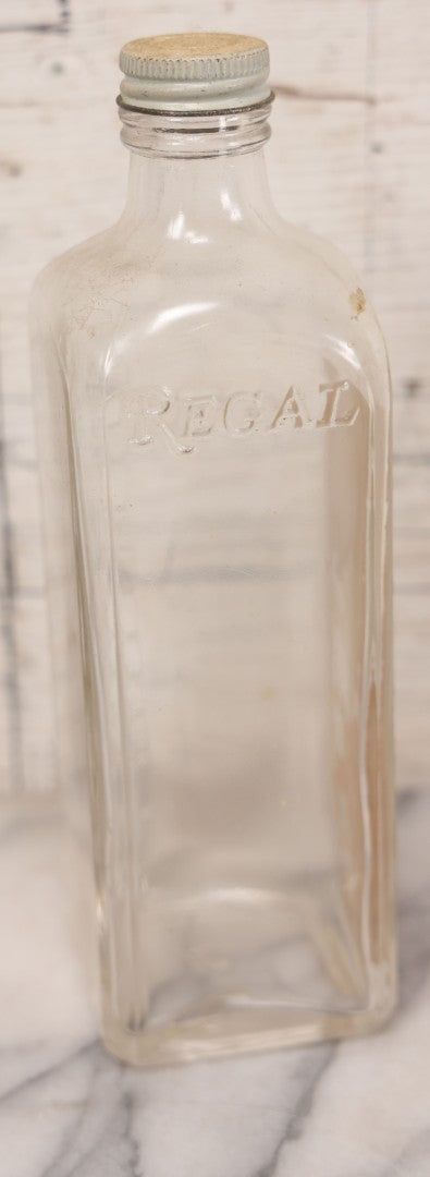 Lot 077 - Pair Of Vintage Clear Glass Embalming Fluid Bottles With Paper Labels And Caps Including Regal Arterial From Regal Fluid Co., Washington, D.C., And Hydrol Phenox From Hydrol Chemical Co., Philadelphia