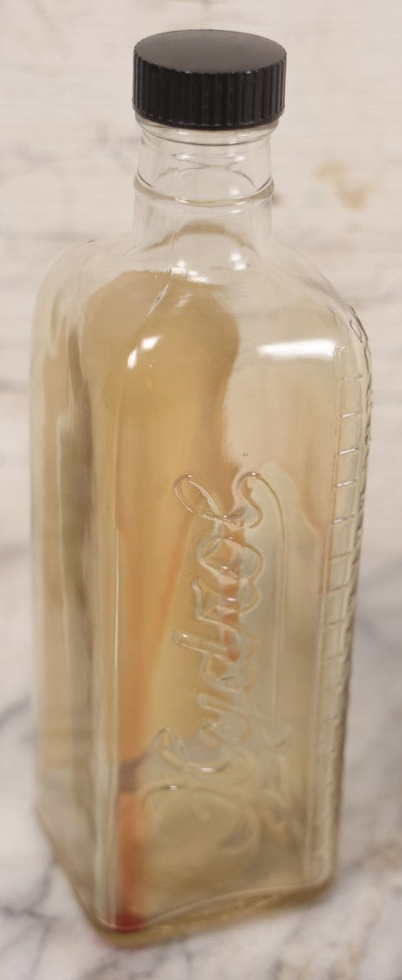 Lot 077 - Pair Of Vintage Clear Glass Embalming Fluid Bottles With Paper Labels And Caps Including Regal Arterial From Regal Fluid Co., Washington, D.C., And Hydrol Phenox From Hydrol Chemical Co., Philadelphia