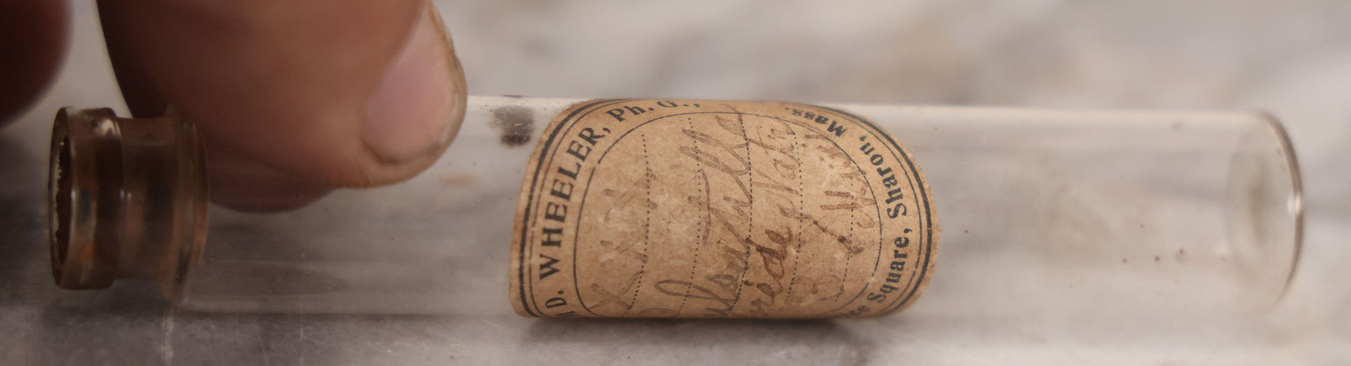 Lot 078 - Grouping Of Eight Antique Apothecary Items Including Amber Bottle With "G.C. Oval" Label, Balsam Bottle, Hall & Lyon Co. Pill Box, Carter's Laxative Vial, Wheeler Pharmacist Vial, Sharon, M.A., Glycerine Jelly Bottle, & John Bull Eye Wash Cup