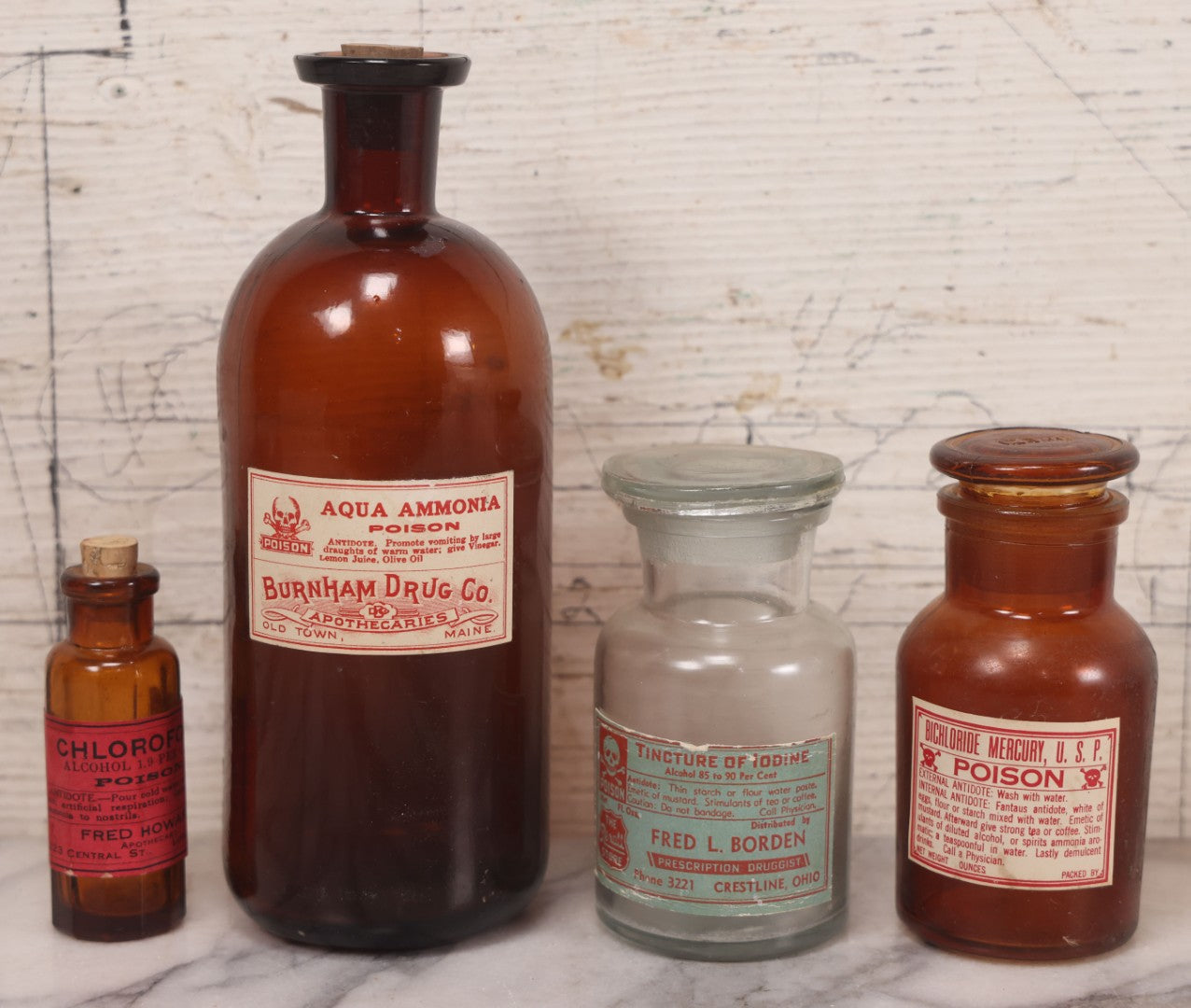Lot 079 - Grouping Of Four Antique Bottles With Later-Applied Labels Including Aqua Ammonia Burnham Drug Co., Old Town M.E., Bichloride Mercury U.S.P., Tincture Of Iodine, Fred. L. Borden, Crestline O.H., & Chloroform Fred Howard Apothecary, Lowell M.A.