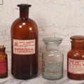 Lot 079 - Grouping Of Four Antique Bottles With Later-Applied Labels Including Aqua Ammonia Burnham Drug Co., Old Town M.E., Bichloride Mercury U.S.P., Tincture Of Iodine, Fred. L. Borden, Crestline O.H., & Chloroform Fred Howard Apothecary, Lowell M.A.