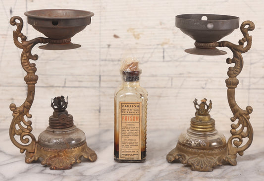 Lot 082 - Antique Vapo-Cresolene Lot Including Two Brass Vaporizers With Lamps (One Complete, One Incomplete) And Poison Bottle With Studded Poison Ribs And Paper Label, Vapo-Cresolene Co., New York, NY