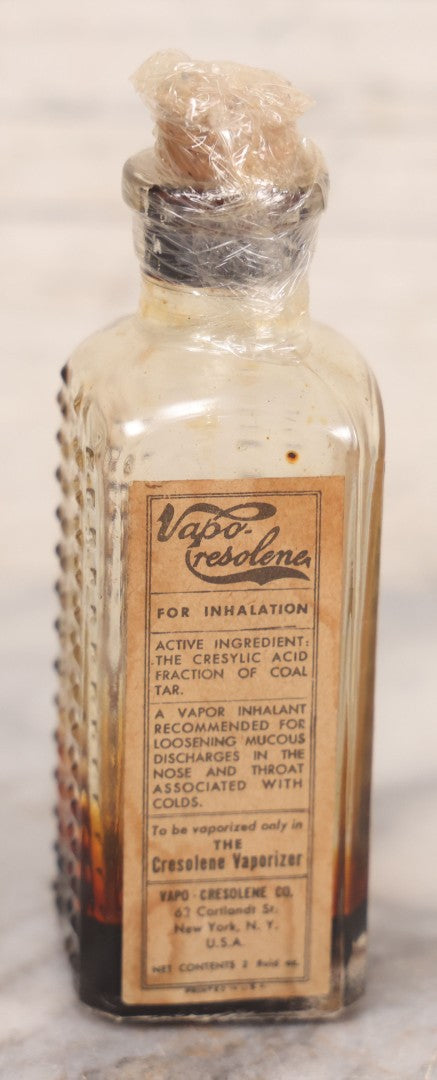 Lot 082 - Antique Vapo-Cresolene Lot Including Two Brass Vaporizers With Lamps (One Complete, One Incomplete) And Poison Bottle With Studded Poison Ribs And Paper Label, Vapo-Cresolene Co., New York, NY