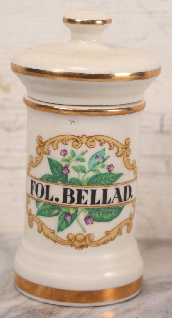 Lot 083 - Reproduction Fantasy Apothecary Jar With Lid Marked “Fol. Bellad.” White Opaque Pottery With Gold Painted Lines, Mid-20th Century, Bottom Marked Made In U.S.A., 7-5/8" H