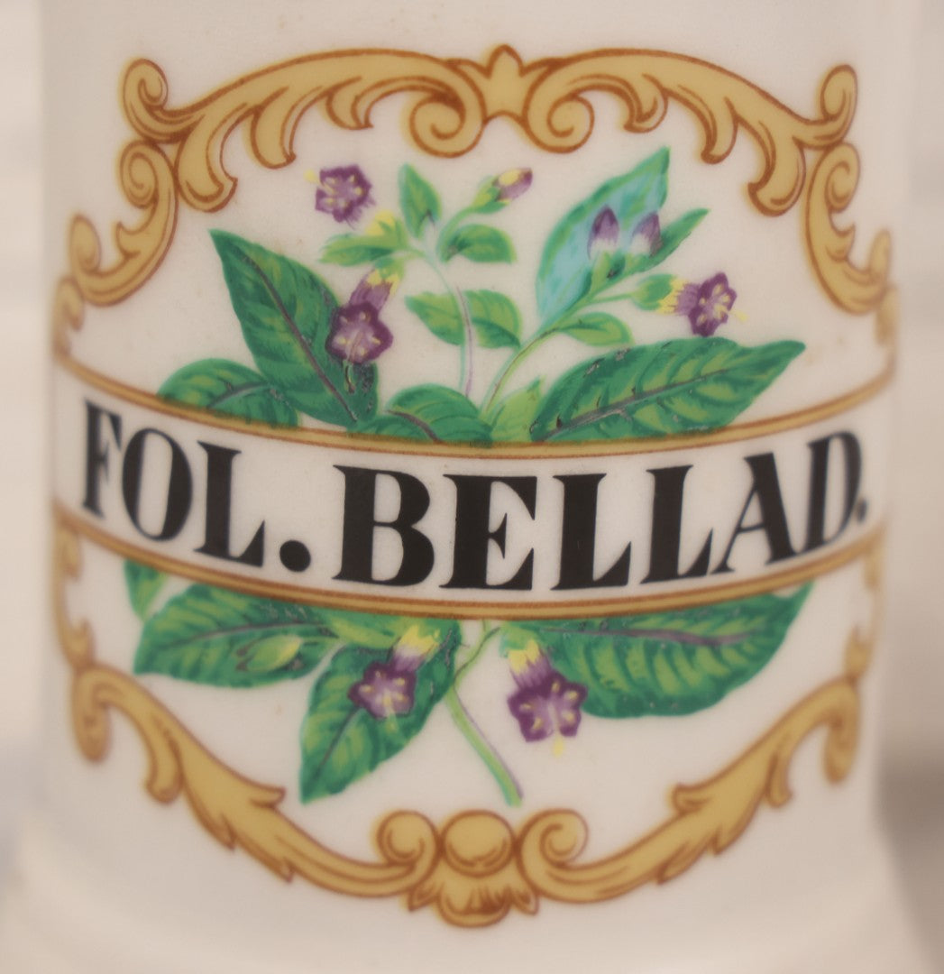 Lot 083 - Reproduction Fantasy Apothecary Jar With Lid Marked “Fol. Bellad.” White Opaque Pottery With Gold Painted Lines, Mid-20th Century, Bottom Marked Made In U.S.A., 7-5/8" H