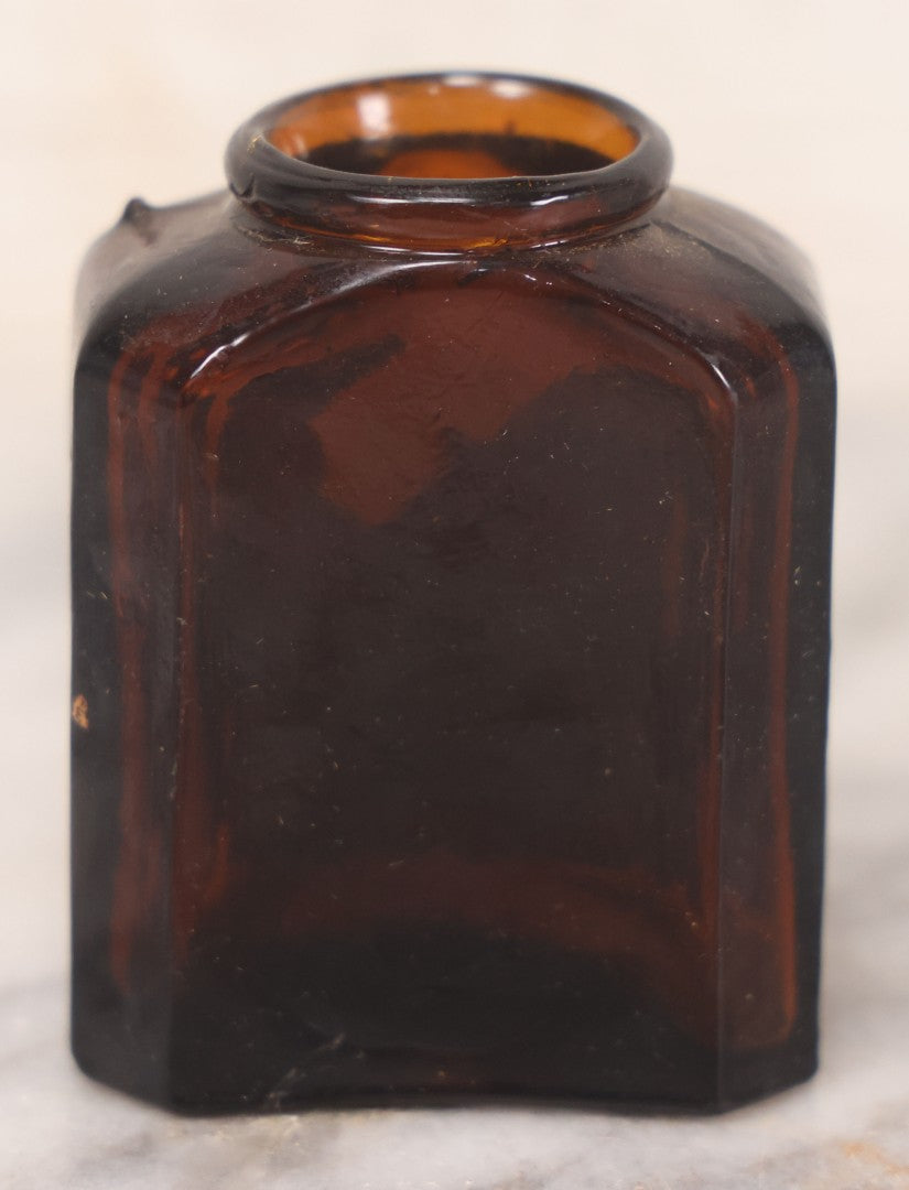 Lot 085 - Pair Of Antique Amber Glass Snuff Bottles With Partial Paper Labels Including West Virginia Snuff And Scott's Snuff