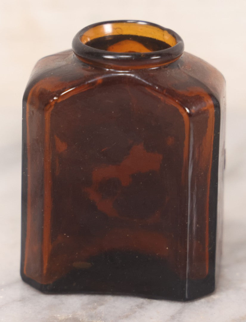 Lot 085 - Pair Of Antique Amber Glass Snuff Bottles With Partial Paper Labels Including West Virginia Snuff And Scott's Snuff