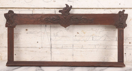 Lot 086 - Antique Hand Carved Wood Folk Art Frame With Griffin Motif, Coat Of Arms, Cherub Corners, Original Finish, 18-1/2" x 9-1/4"