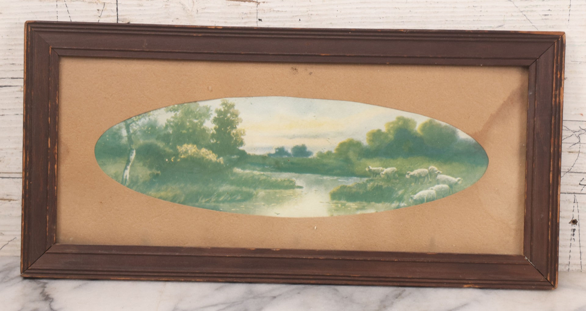 Lot 091 - Antique Landscape Print Of Sheep In A Field By A River With Oval Cut Mat, In Long Narrow Frame, 6-1/2" x 13-1/2"