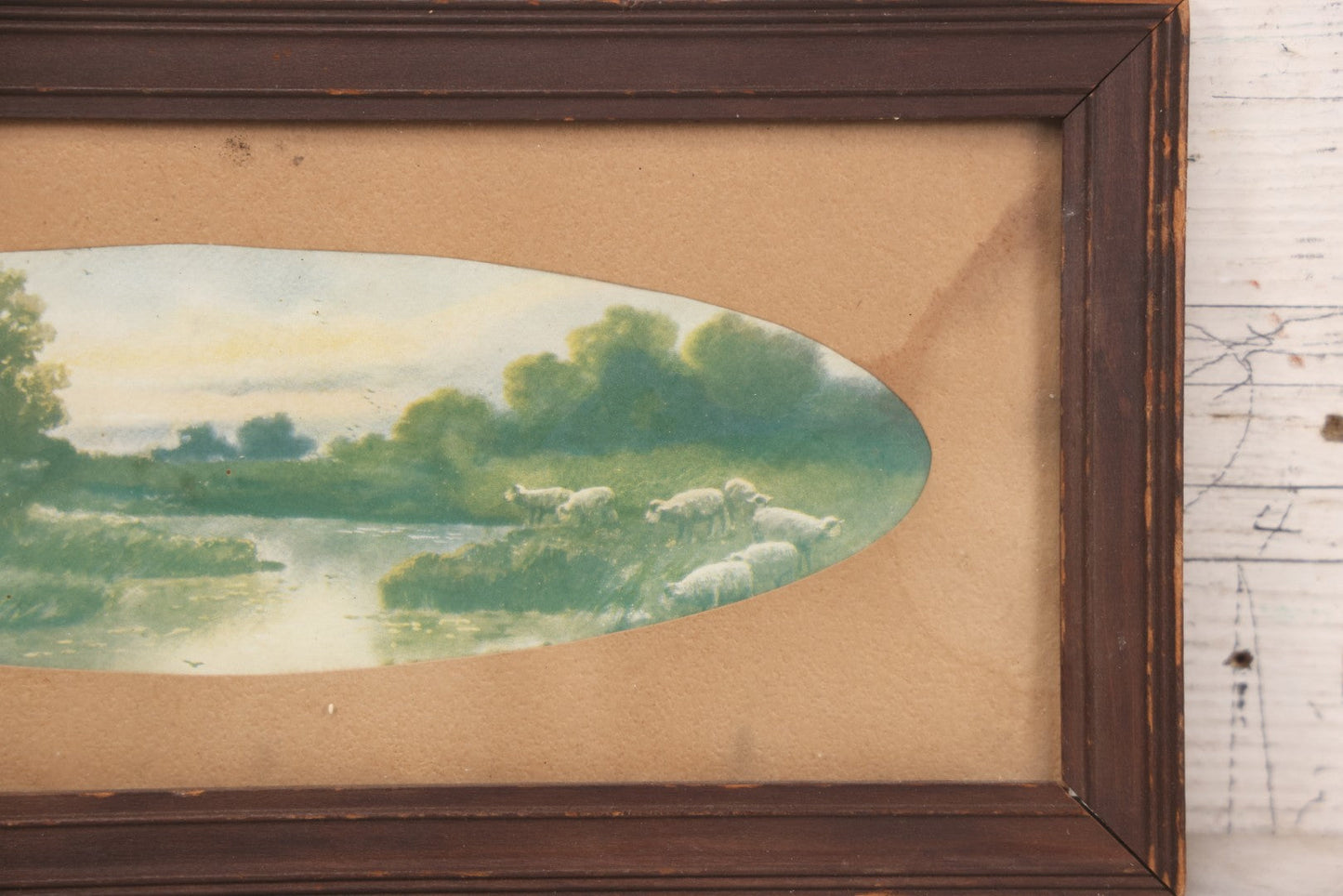 Lot 091 - Antique Landscape Print Of Sheep In A Field By A River With Oval Cut Mat, In Long Narrow Frame, 6-1/2" x 13-1/2"