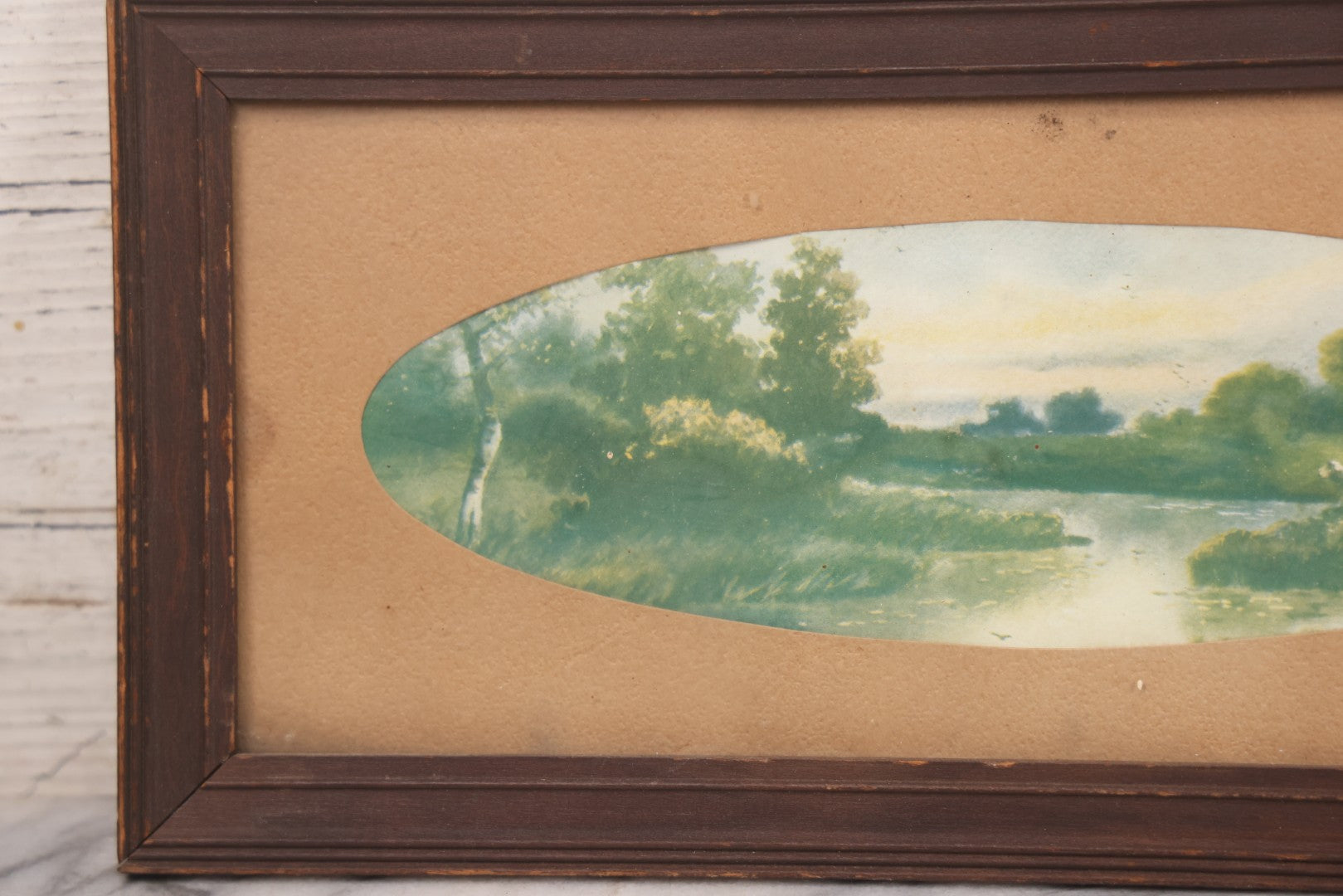 Lot 091 - Antique Landscape Print Of Sheep In A Field By A River With Oval Cut Mat, In Long Narrow Frame, 6-1/2" x 13-1/2"
