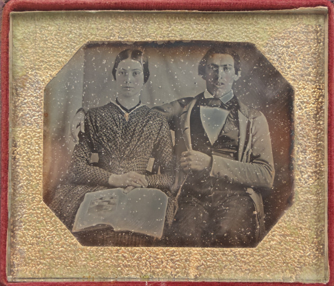 Lot 093 - Antique 1/6th Plate Daguerreotype Photograph Of Couple In Full Leatherette Case, Gold Painted Border, Faded Red Cushion, Anthony, Clark & Co. Label On Verso, Note Damage To Case