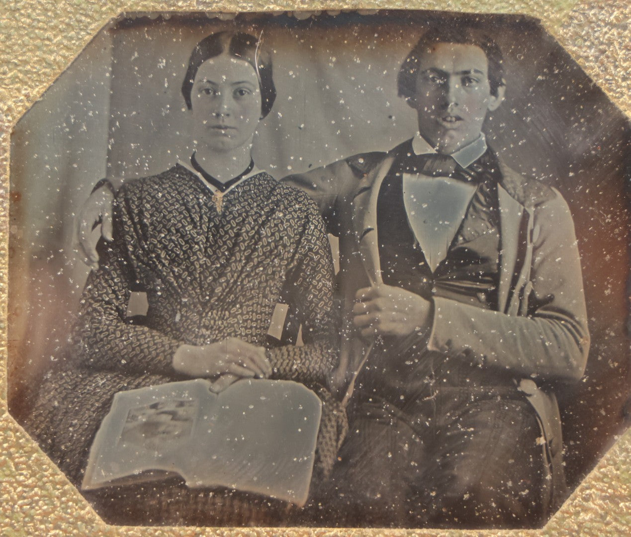 Lot 093 - Antique 1/6th Plate Daguerreotype Photograph Of Couple In Full Leatherette Case, Gold Painted Border, Faded Red Cushion, Anthony, Clark & Co. Label On Verso, Note Damage To Case