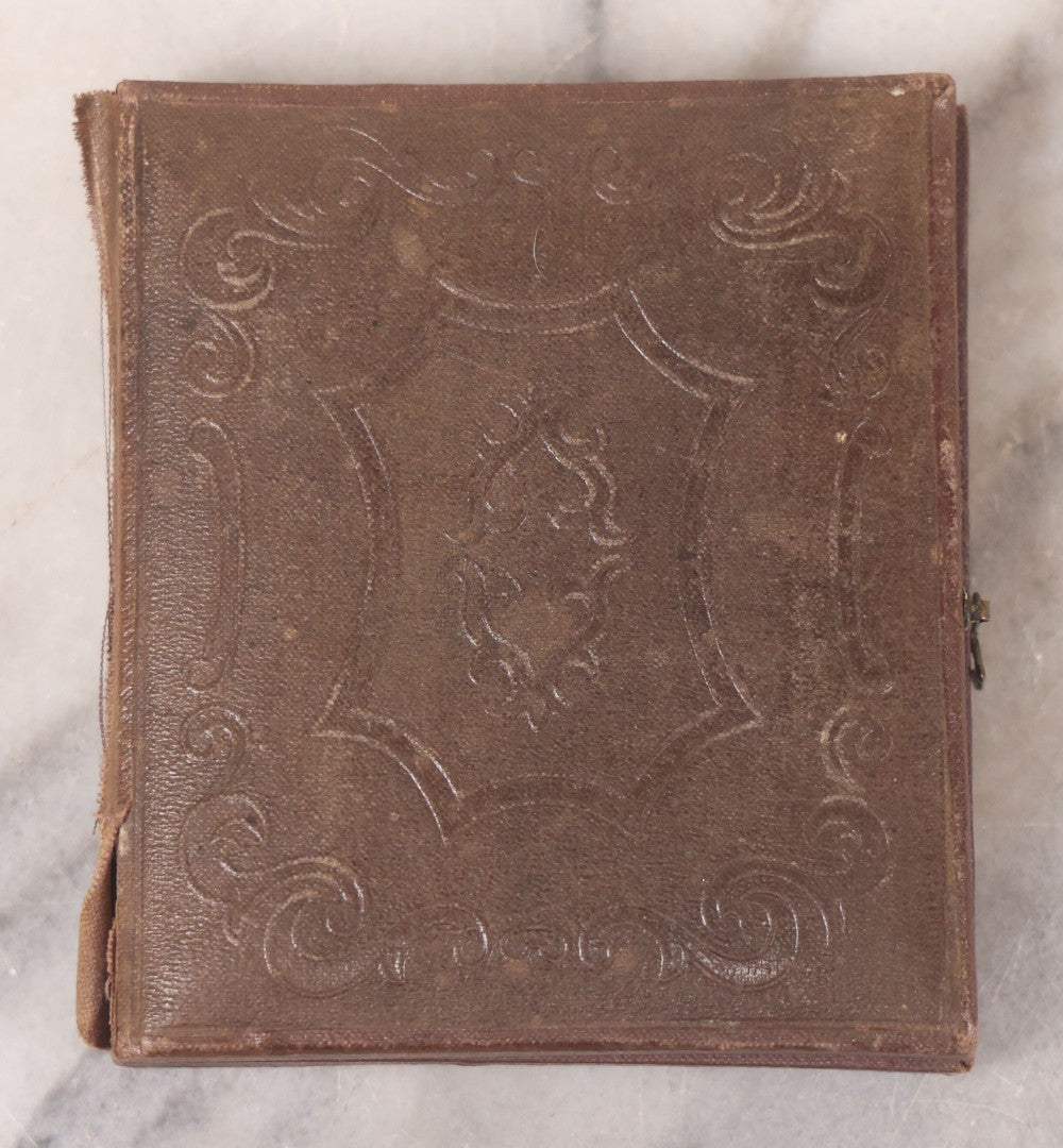 Lot 093 - Antique 1/6th Plate Daguerreotype Photograph Of Couple In Full Leatherette Case, Gold Painted Border, Faded Red Cushion, Anthony, Clark & Co. Label On Verso, Note Damage To Case